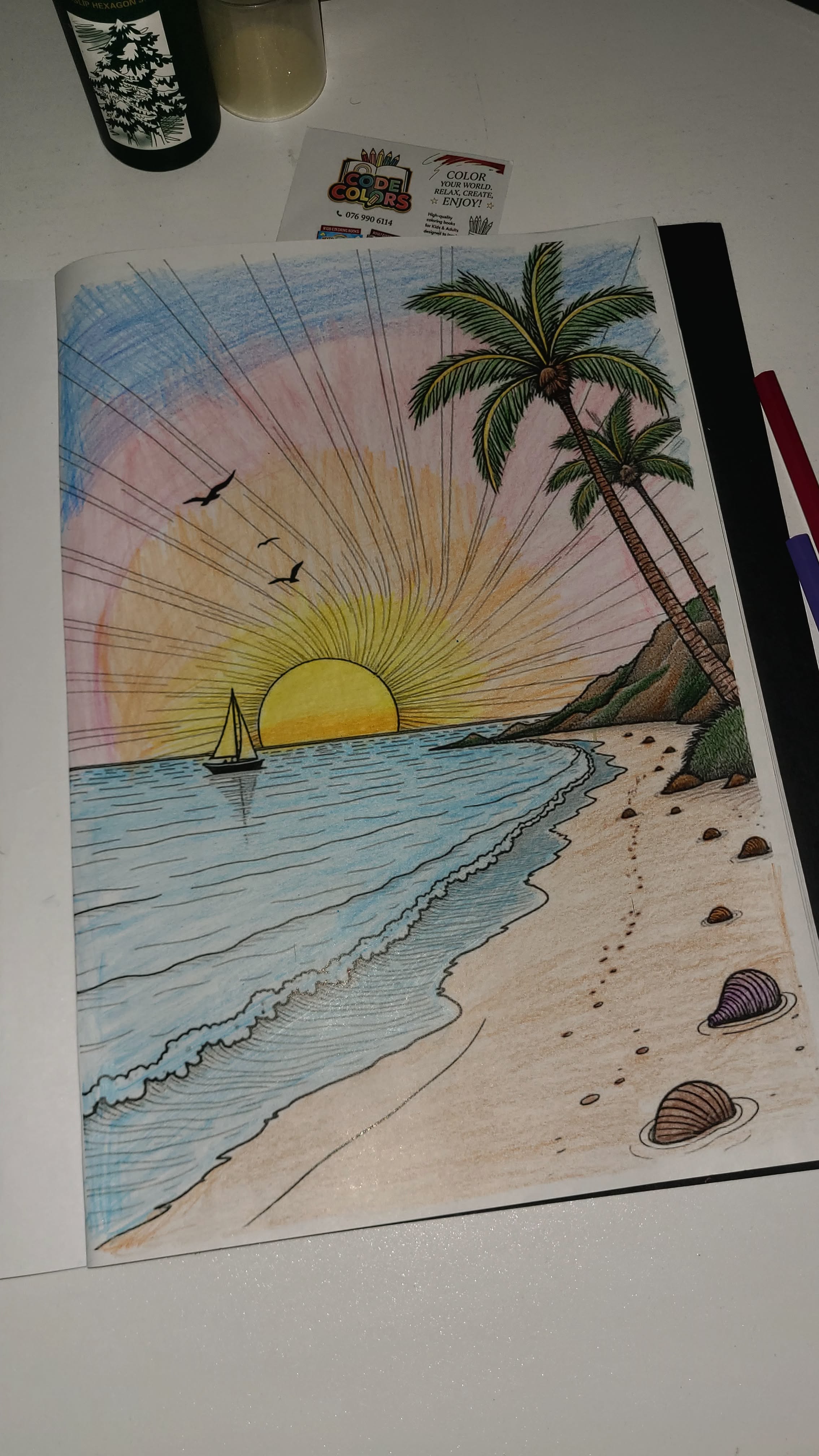 Vibrant Sunset with Sailboat and Palm Trees