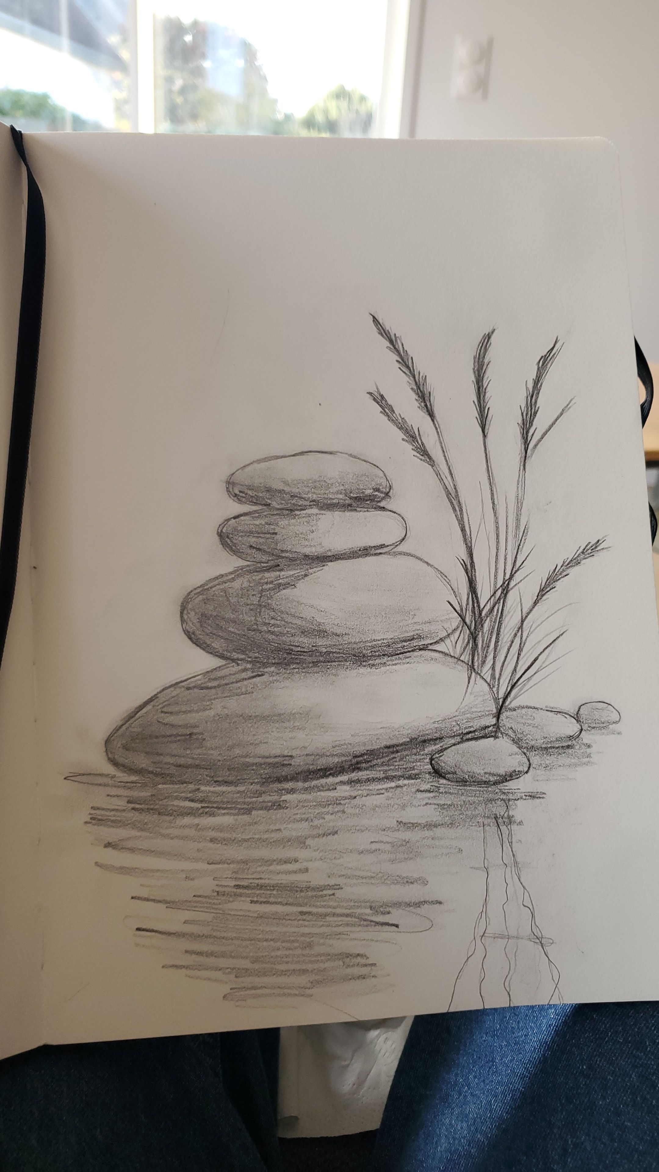 Tranquil Stacked Pebbles Near Water