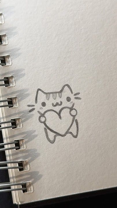 Adorable Cat Holding a Heart