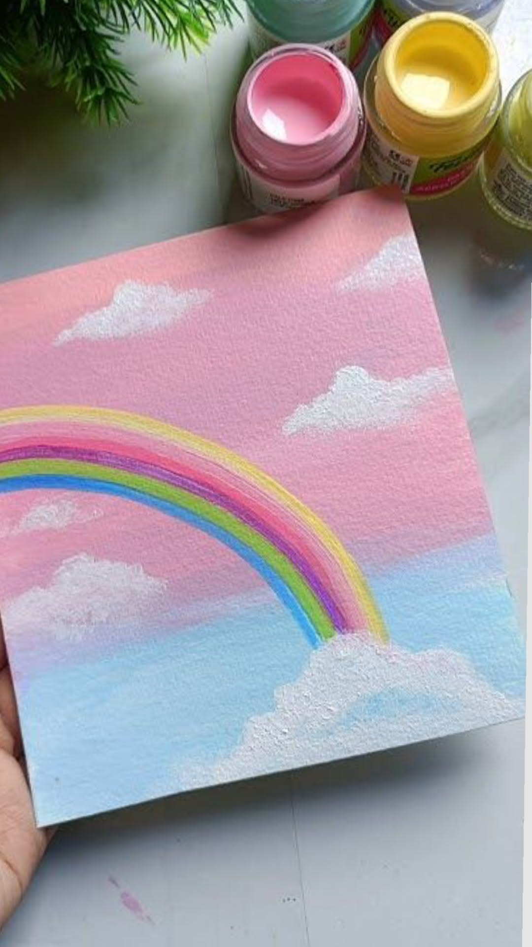 Colorful Rainbow with Fluffy Clouds