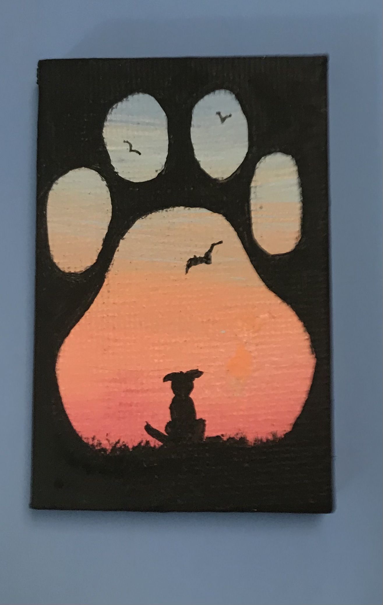 Cute Dog Silhouette in Paw Print Sunset
