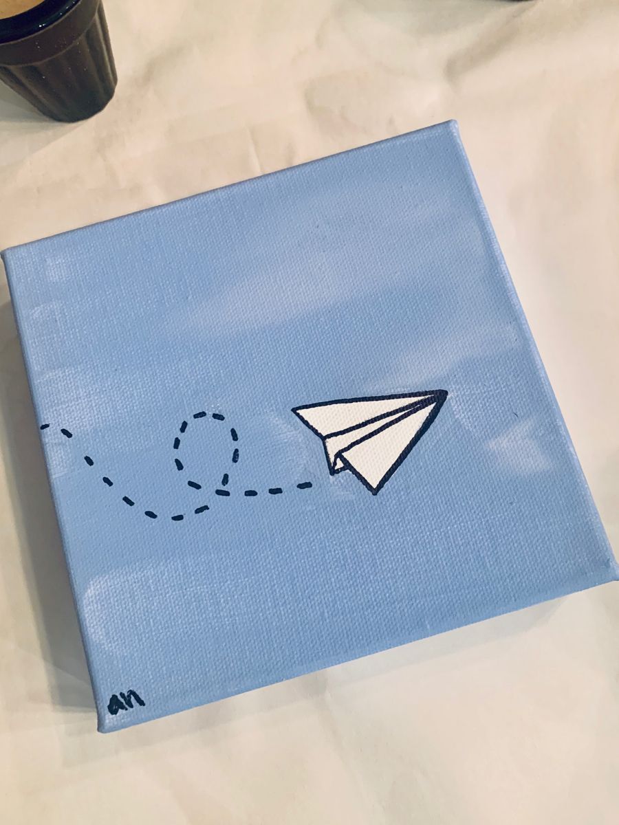 Simple Paper Airplane on Blue Canvas