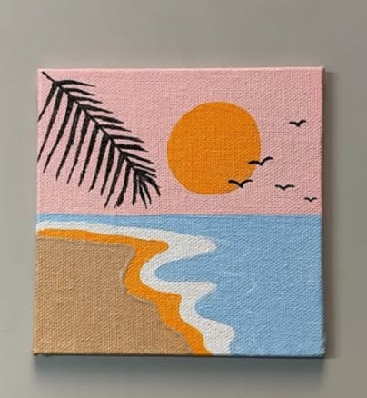 Tranquil Beach Sunset with Palm Leaf