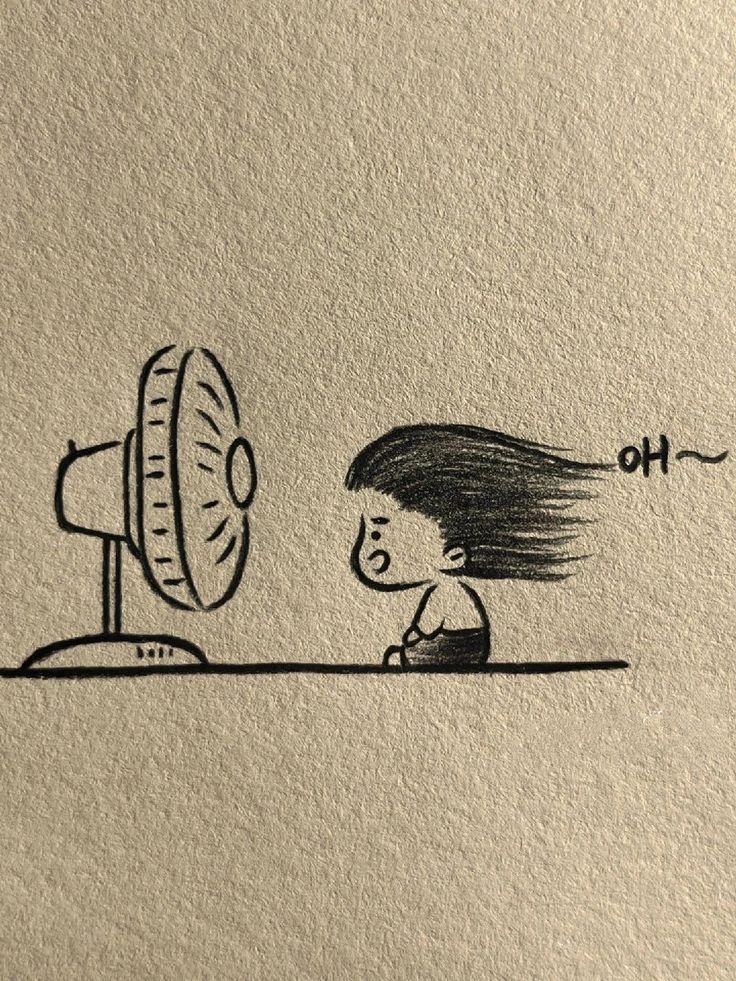 Kid Enjoying a Breeze from a Fan