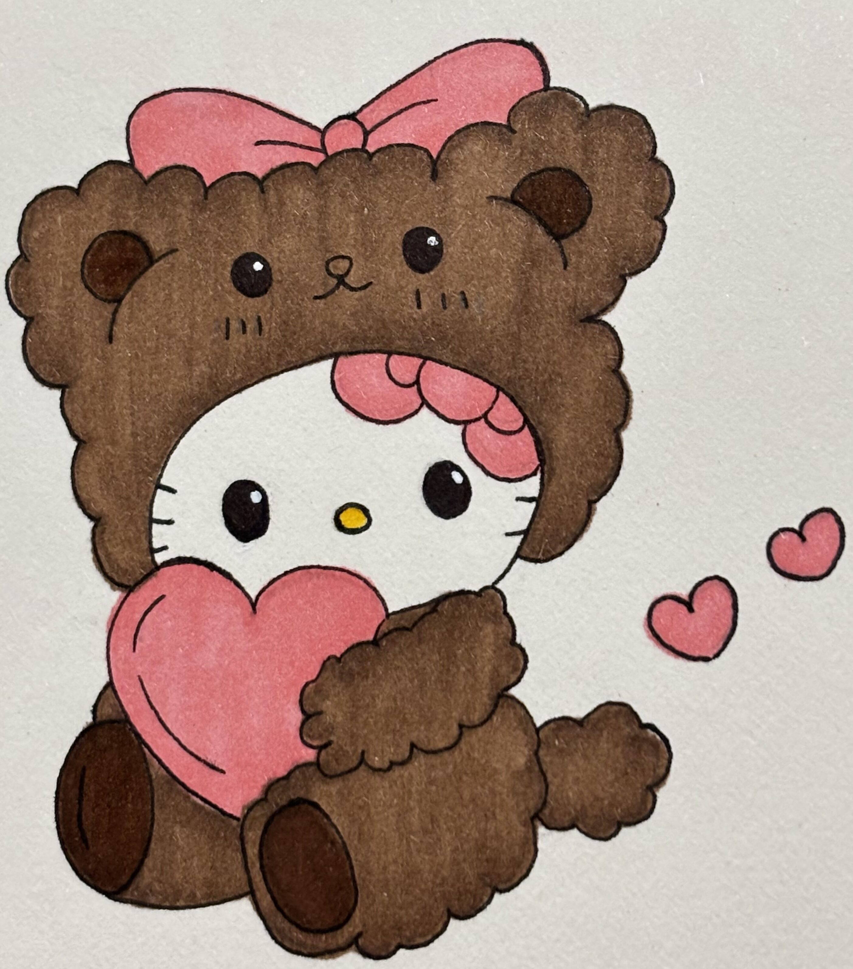 Cute Kitty in Bear Suit Holding Heart