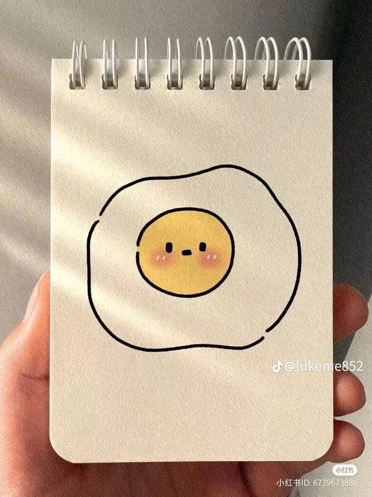 Adorable Smiling Egg on Notepad